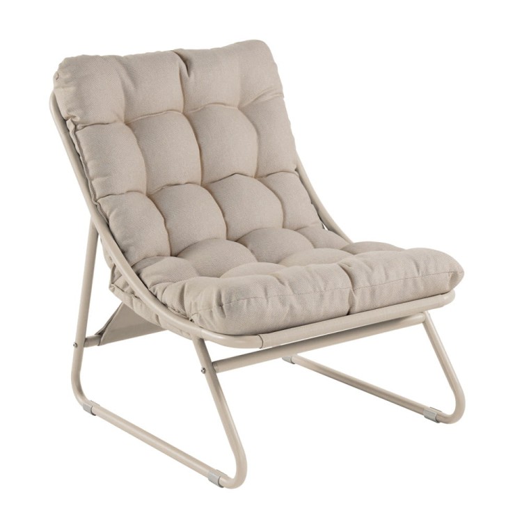 Fotel bujany z podnóżkiem i stolikiem.